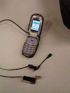 A670 clamshell cell phone with Y-cable connected to microlite switch and handsfree headset