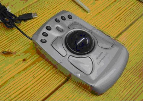 Image of Kensington ExpertMouse Trackball with ball retaining bracket covering the lower half of the trackball.